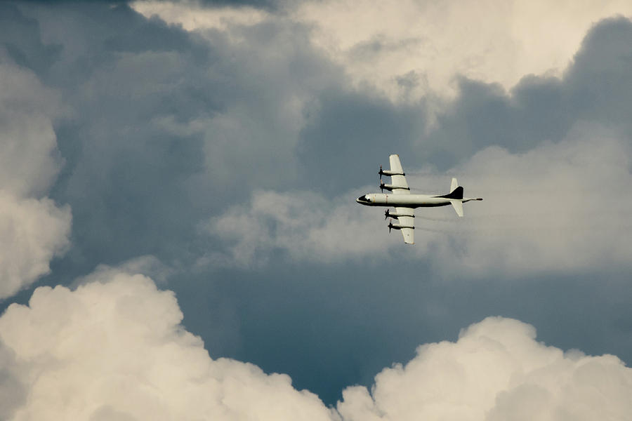 Lockheed P-3C Orion flying through the clouds Photograph by Scott Lyons