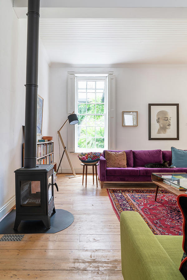 Log-burning Stove And Sofas In Purple Velvet And Lime-green Upholstery In Living Room Photograph by Barbara Cilliers