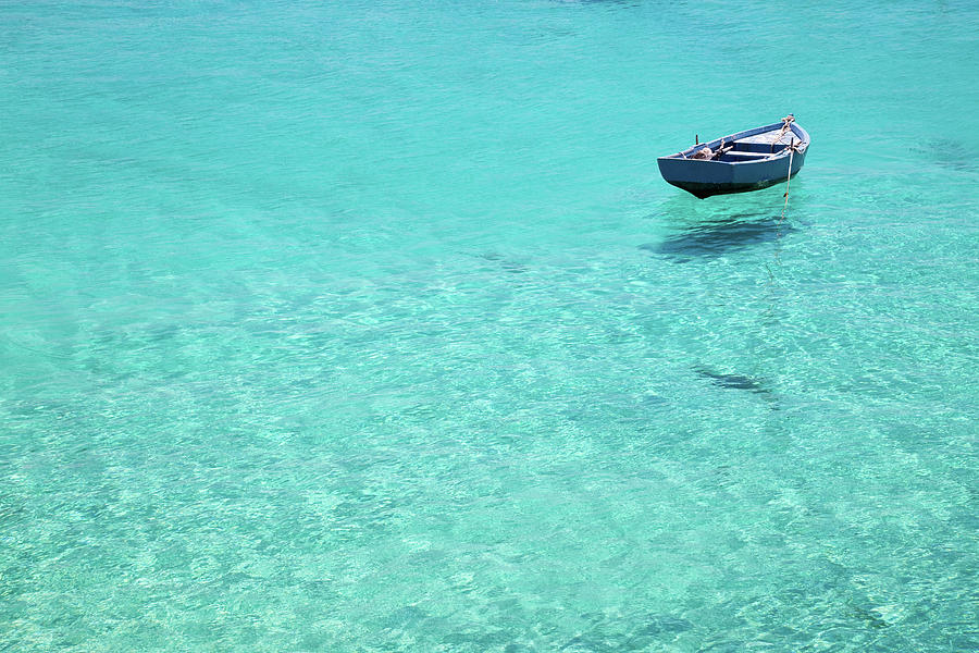 Lone Boat In Crystal Water Photograph by Photovideostock