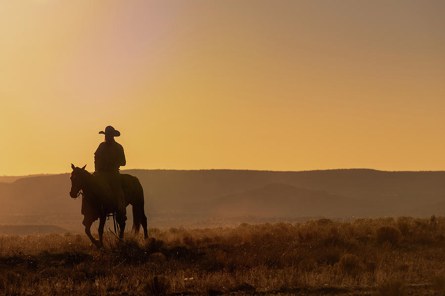 Lone Desert Cowboy Riding At Sunrise Photograph