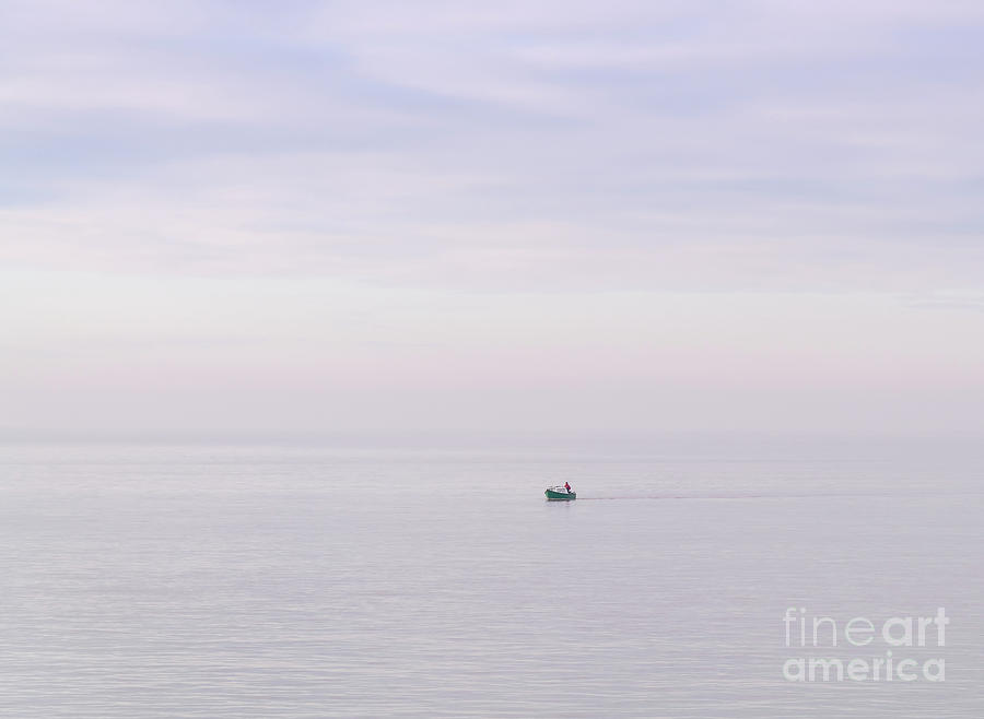 Lone sailor Photograph by Colin Rayner