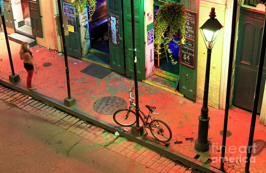 Lonely Bike on Bourbon Street at Night New Orleans Photograph by John Rizzuto