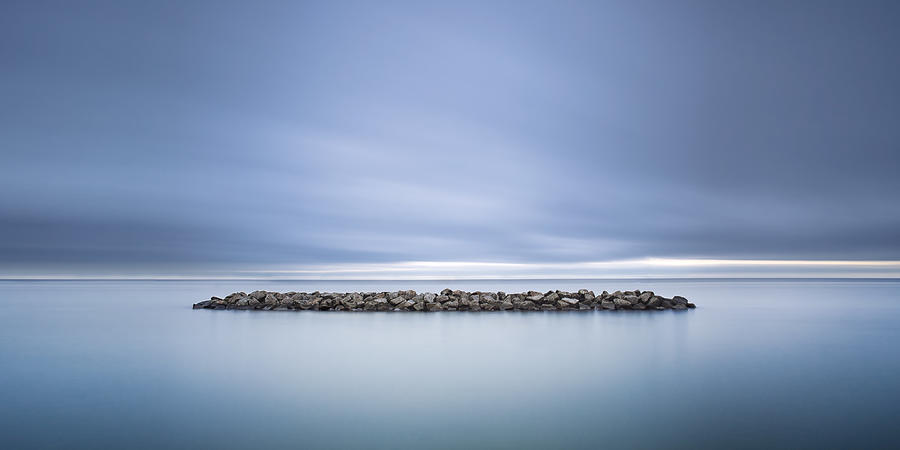 Pebbles Photograph - Lonely In A Sea Of Dreams by Dragos Ioneanu