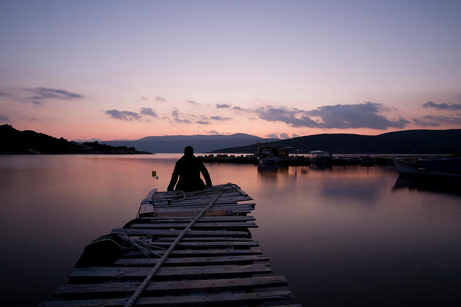 Lonely Man Sitting Side Of The Dock Photograph by Kasayizgi
