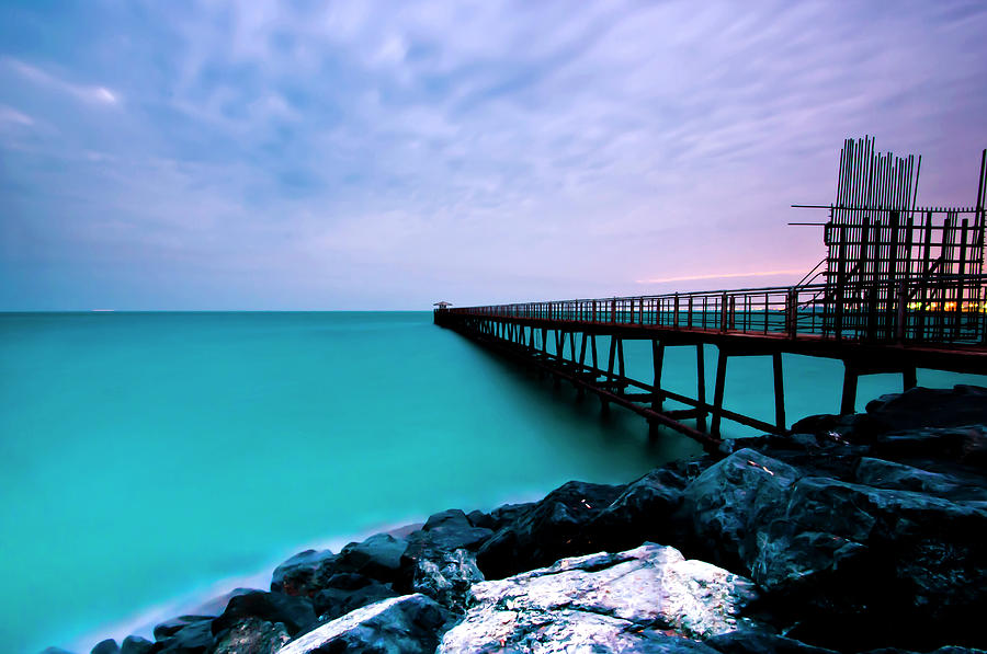 Long Exposure Of Wooden Pier Over Water Photograph by Cultura Rf/shahbaz Hussain