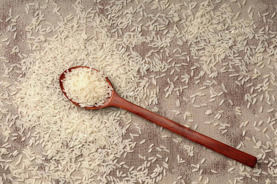 Long Grain Rice With A Wooden Spoon Photograph by Riou, Jean-christophe