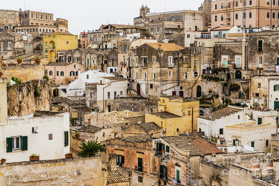 Long panoramic views of the rocky old town of Matera with its st Photograph by Joaquin Corbalan
