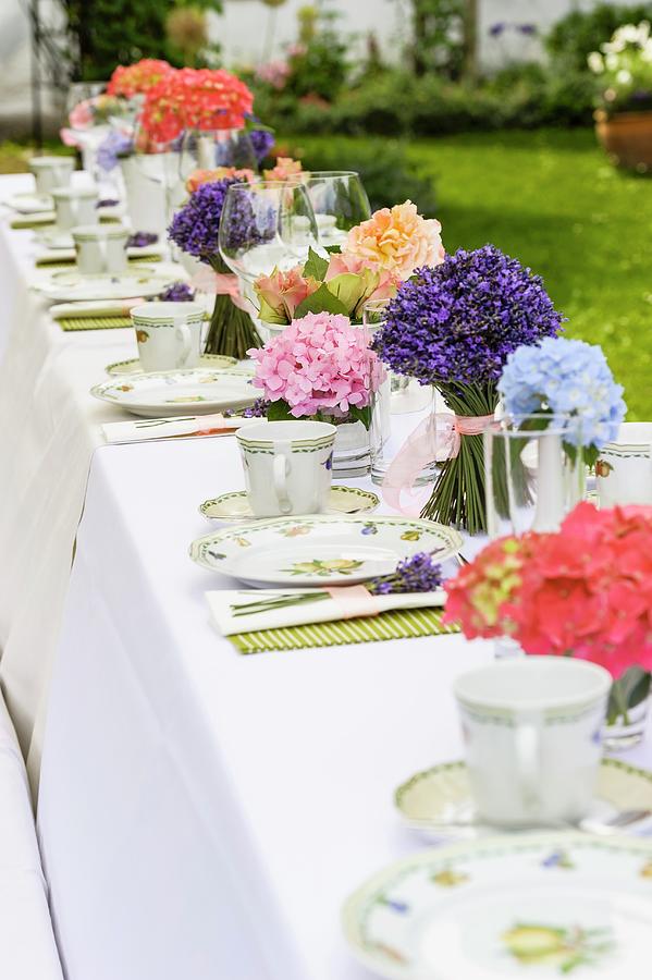 Long Table Set For Afternoon Coffee With Posies Of Lavender And Other Flowers Photograph by Rita Newman