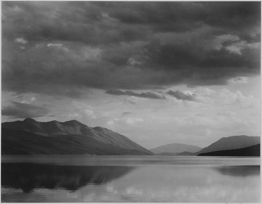 Looking across lake to mountains and clouds Evening McDonald Lake Glacier National Park Montana. 1933 - 1942 Painting by Ansel Adams