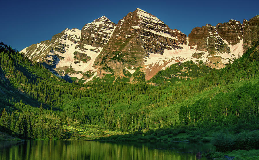 Looming Maroon Bells Photograph by Don Schwartz