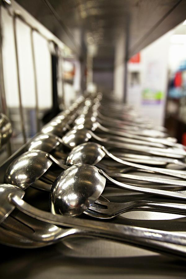Lots Of Ladles In The Kitchen Of A Restaurant Photograph by Lehmann, Herbert