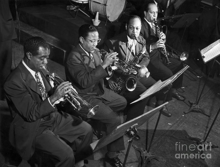 Louis Armstrong And Jazz Combo Playing Photograph by Bettmann