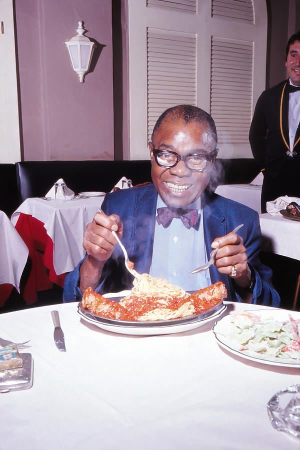 Louis Armstrong Photograph - Louis Armstrong Eating Spaghetti by Paul Slade