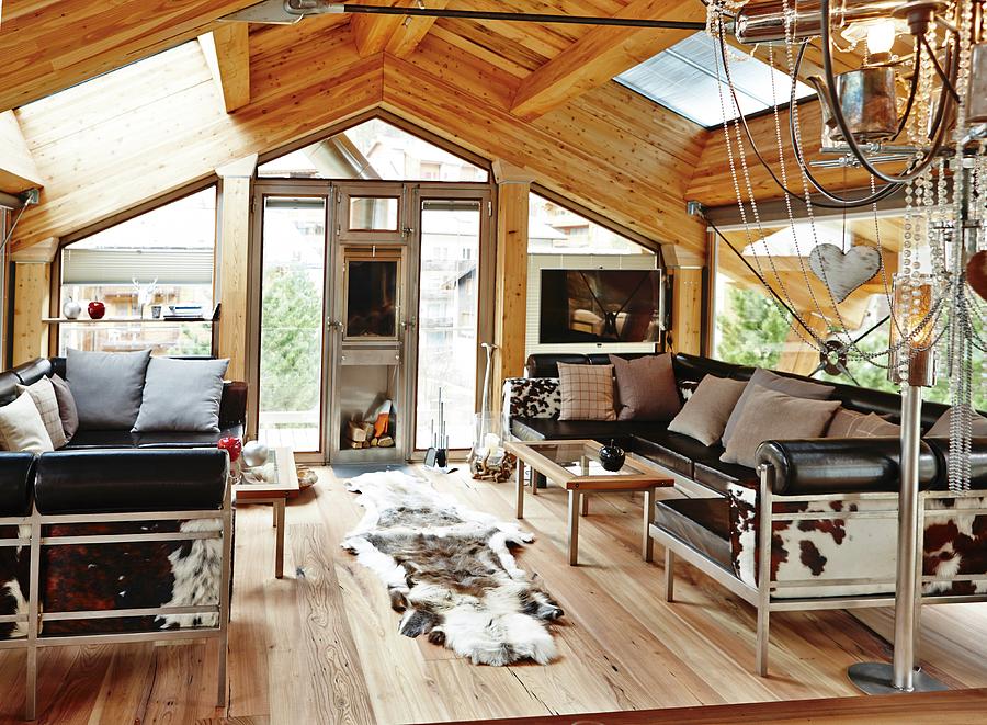 Lounge Area With Leather Sofa Set And Animal-skin Rug In Roof Space Of  Modern Chalet Photograph by Misha Vetter - Fine Art America