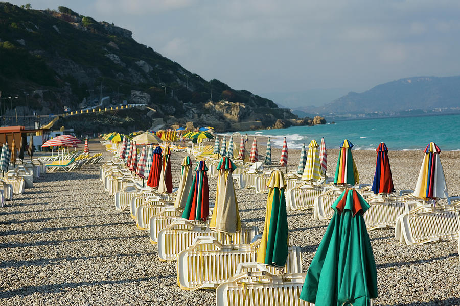 Lounge Chairs And Beach Umbrellas On Photograph by Glowimages