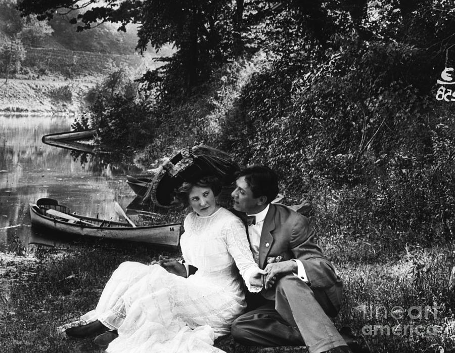 Lovers Relaxing Along The Shore Photograph by Bettmann