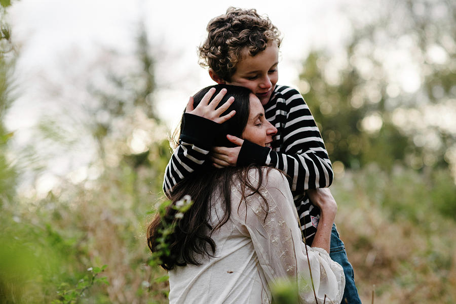 Loving Son Embracing Mother At Park Photograph by Cavan Images - Fine ...