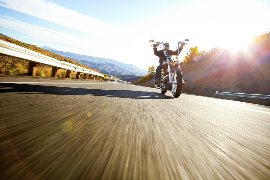Low-angle Of Motorcyclist On Windy Road Photograph by Tyler Stableford