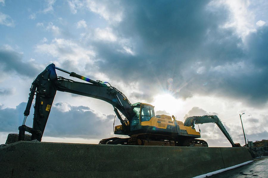 Truck Digital Art - Low Angle Silhouetted View Of Two Excavators Parked Back To Back by Pete Saloutos