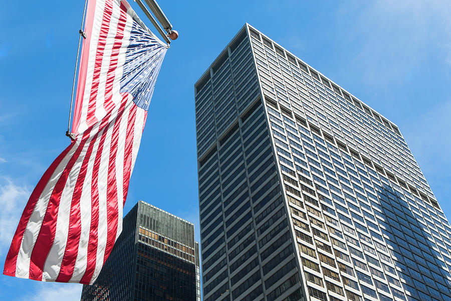 Low Angled View Of Skyscrapers And American Flag In Financial District ...