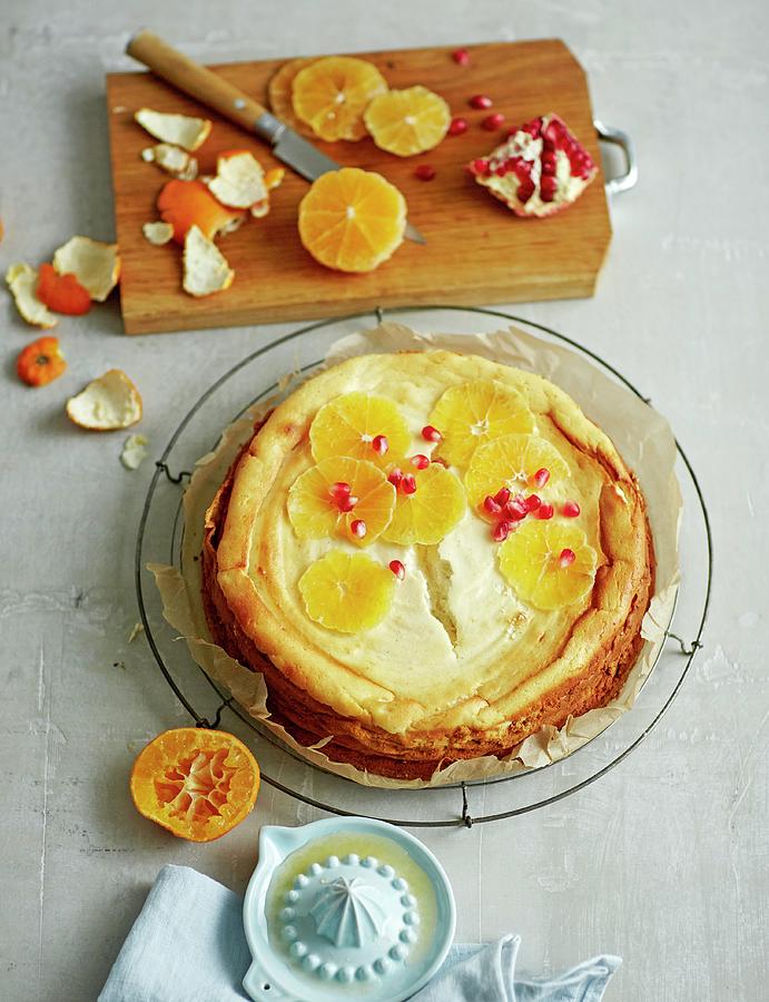 Low-fat Orange Cheesecake With A Melba Toast And Apricots Base, Low-fat Quark, Yoghurt Cream Cheese And Pomegranate Seeds Photograph by Jalag / Julia Hoersch