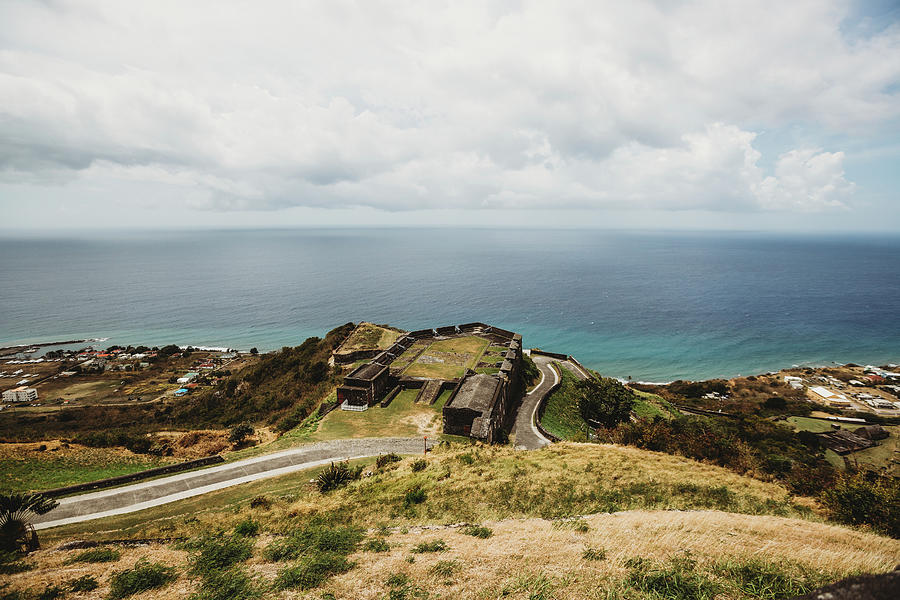 Nature Photograph - Lush Landscape View Of Winding Road And Atlantic Ocean On St Kitts by Cavan Images