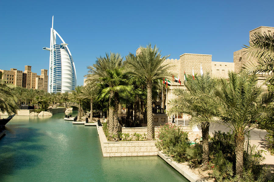 Luxury Hotel Burj Al Arab With Oasis And Palm Trees, Madinat Jumeirah, Dubai, United Arab Emirates Photograph by Hermann Erber