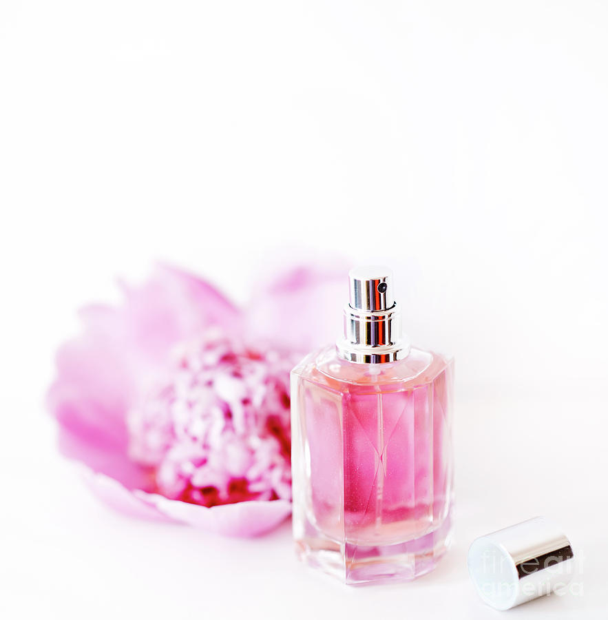 Flowers Still Life Photograph - Luxury perfume bottle and pink peony flower isolated on white ba by Jelena Jovanovic