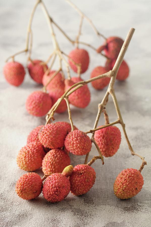 Lychees On A Sprig Photograph by Jean-christophe Riou