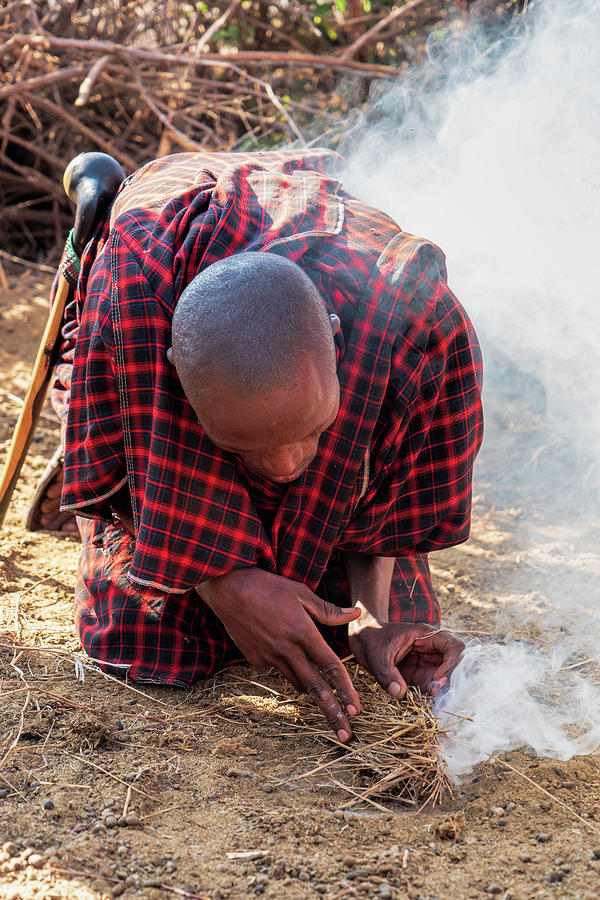 Maasai Man Lighting the Fire Photograph by Betty Eich