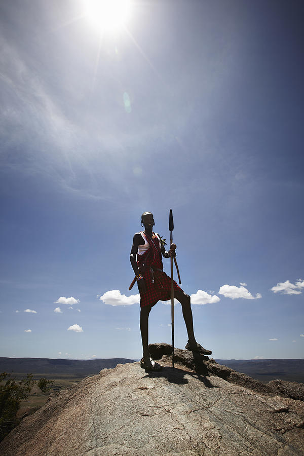 Maasai Man Standing On Top Of Rock Photograph by Niels Busch