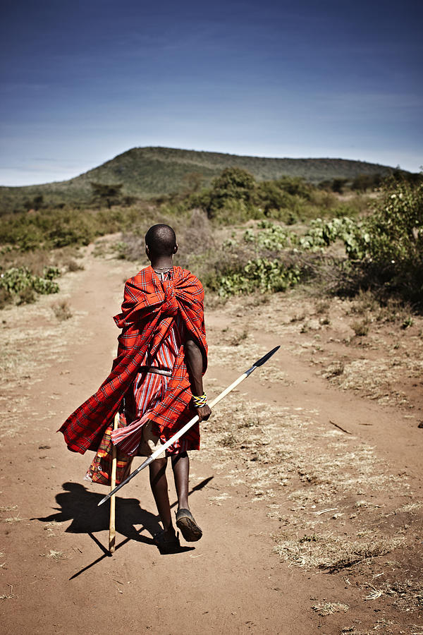 Maasai Man Walking On Dirt Road Photograph by Niels Busch