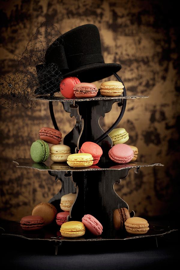 Macaroons On A Tiered Cake Stand With A Hat Photograph by Raben, Sven C.
