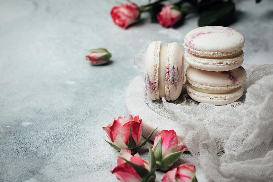 Macaroons With Rose Buds Photograph by Kate Prihodko