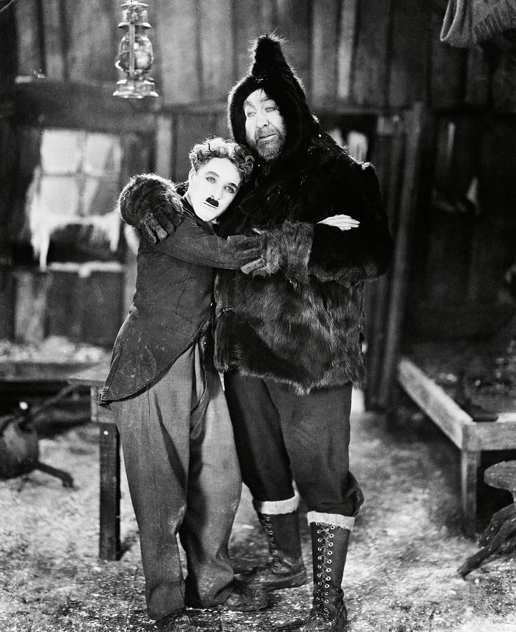 MACK SWAIN and CHARLIE CHAPLIN in THE GOLD RUSH -1925-. Photograph by Album