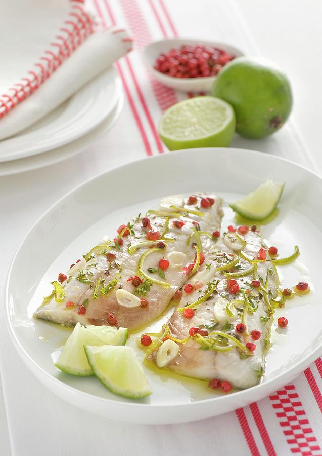 Mackerel Fillets With Pink Pepper, Limes And Garlic Photograph by Franco Pizzochero