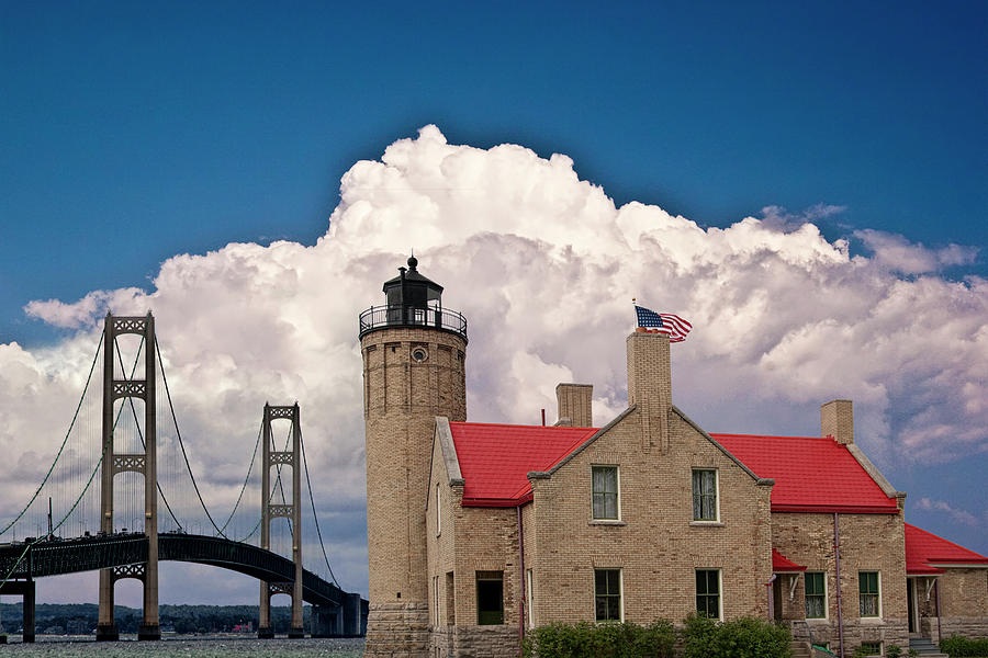Mackinac Bridge and the Mackinaw City Lighthouse at the Straits of Mackinac in Michigan Photograph by Randall Nyhof