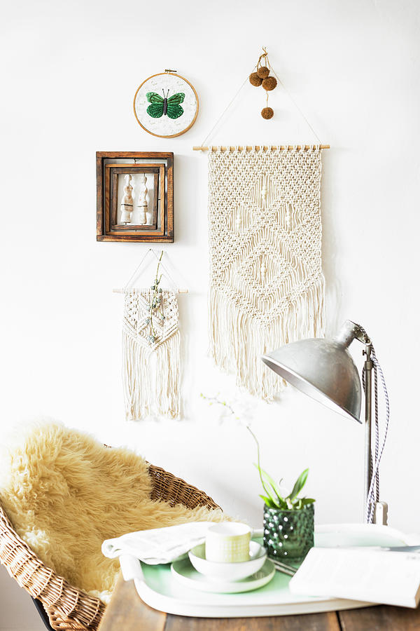 Macrame Wall Hanging On White Wall With Cup And Flowers On Tray In Foreground Photograph by Sabine Lscher