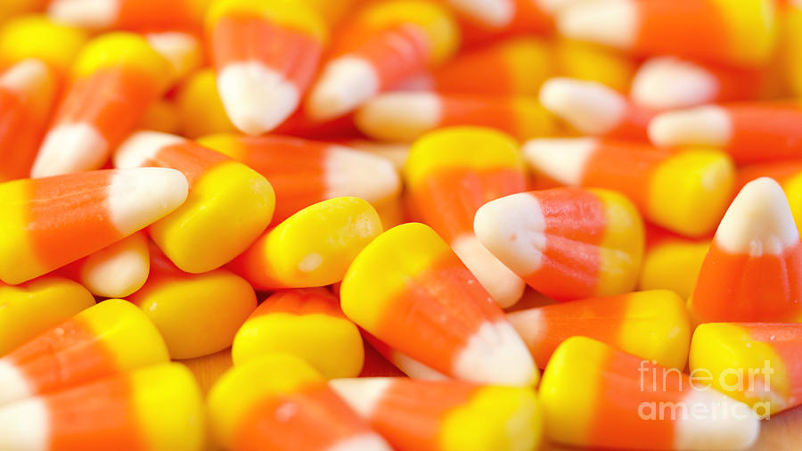 Macro closeup of Halloween traditional Candy Corn treats. Photograph by Milleflore Images