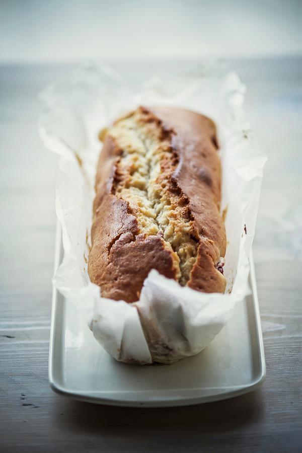 Madeira Cake In Baking Paper Photograph by Imagerie