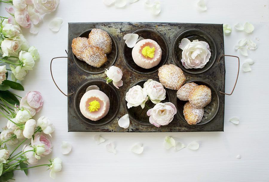 Madeleines And Wagashi With Roses In An Antique Baking Tray With Roses Photograph by Schindler, Martina