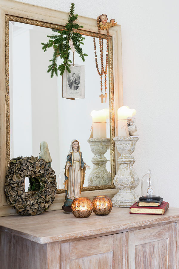 Madonna Figurine, Arrangement Of Candles And Large Mirror On Cabinet Photograph by Studio Lumino