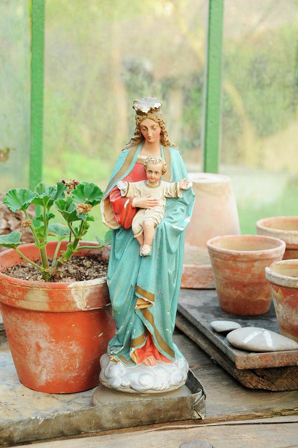 Madonna Figurine In Greenhouse Photograph by Revier 51