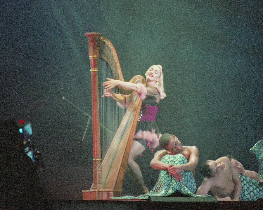 Madonna Photograph - Madonna Playing Harp On Stage During Concert by Globe Photos