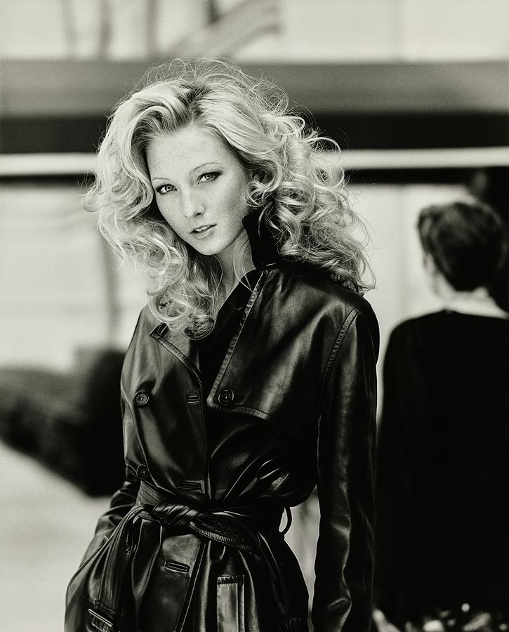 Maggie Rizer Wearing A Leather Trench Coat Photograph by Arthur Elgort