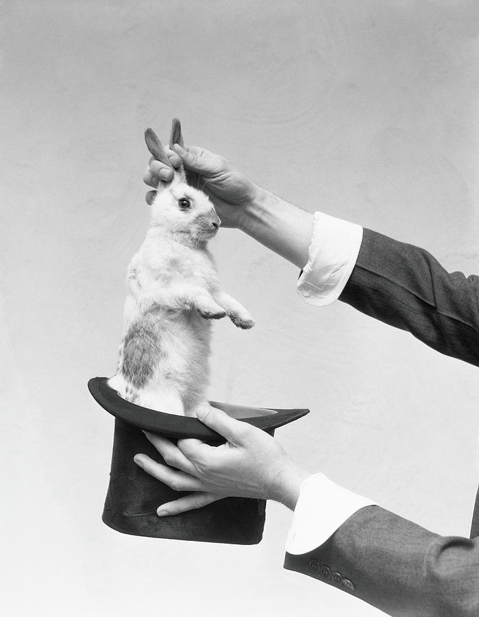 magician-pulling-rabbit-out-of-hat-by-h-armstrong-roberts