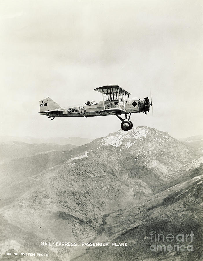 Mail Biplane Flying Over Mountains Photograph by Bettmann
