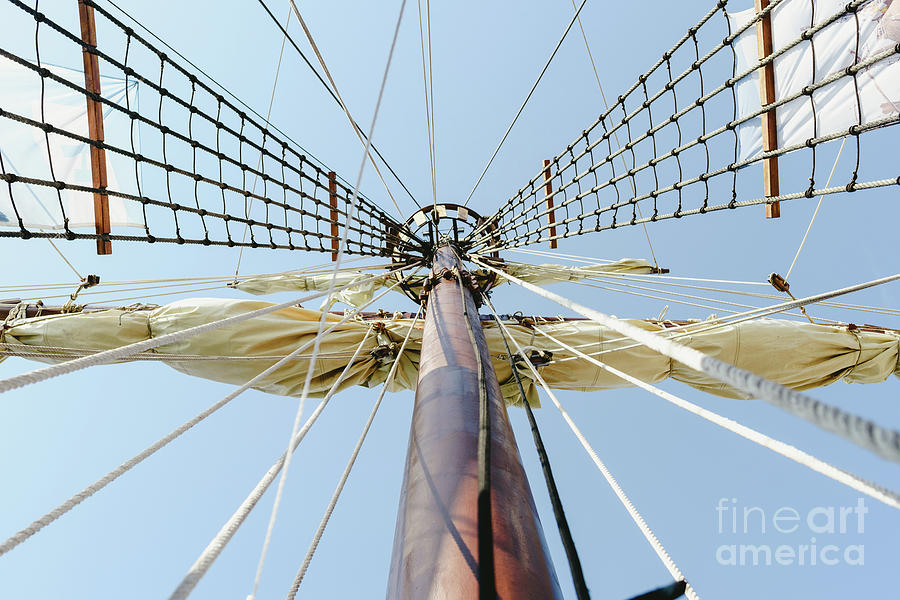 Mainmast and rope ladders to hold the sails of a sailboat. Photograph by Joaquin Corbalan