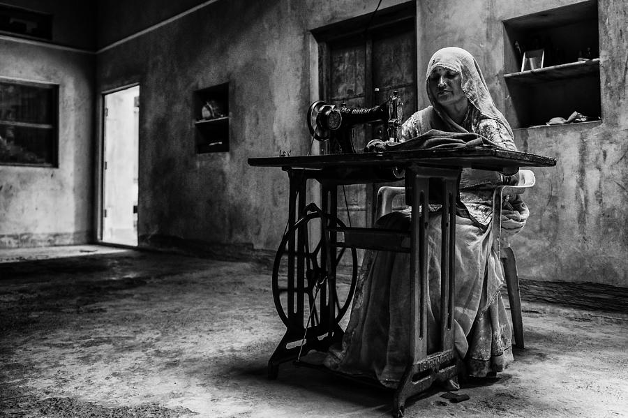 Black And White Photograph - Making A Living by Mohammed Alnaser