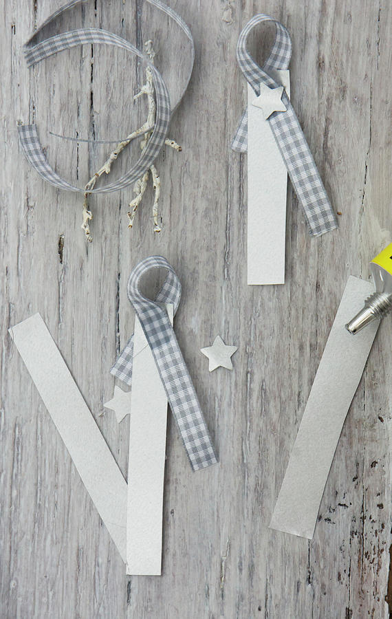 Making Festive Name Tags From Strips Of Paper And Gingham Ribbon Photograph by Martina Schindler